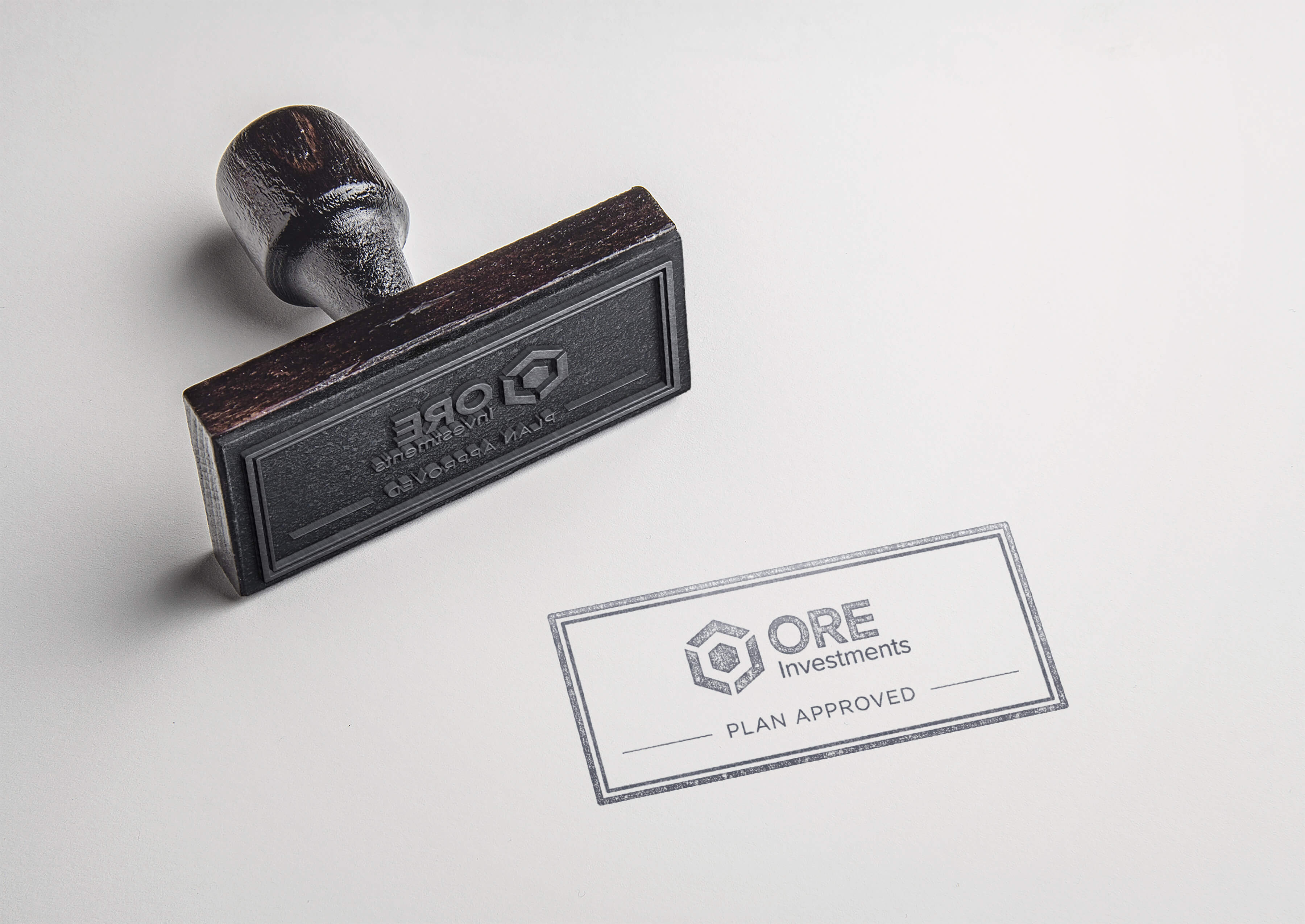 ORE Investments logo "plan approved" rubber stamp